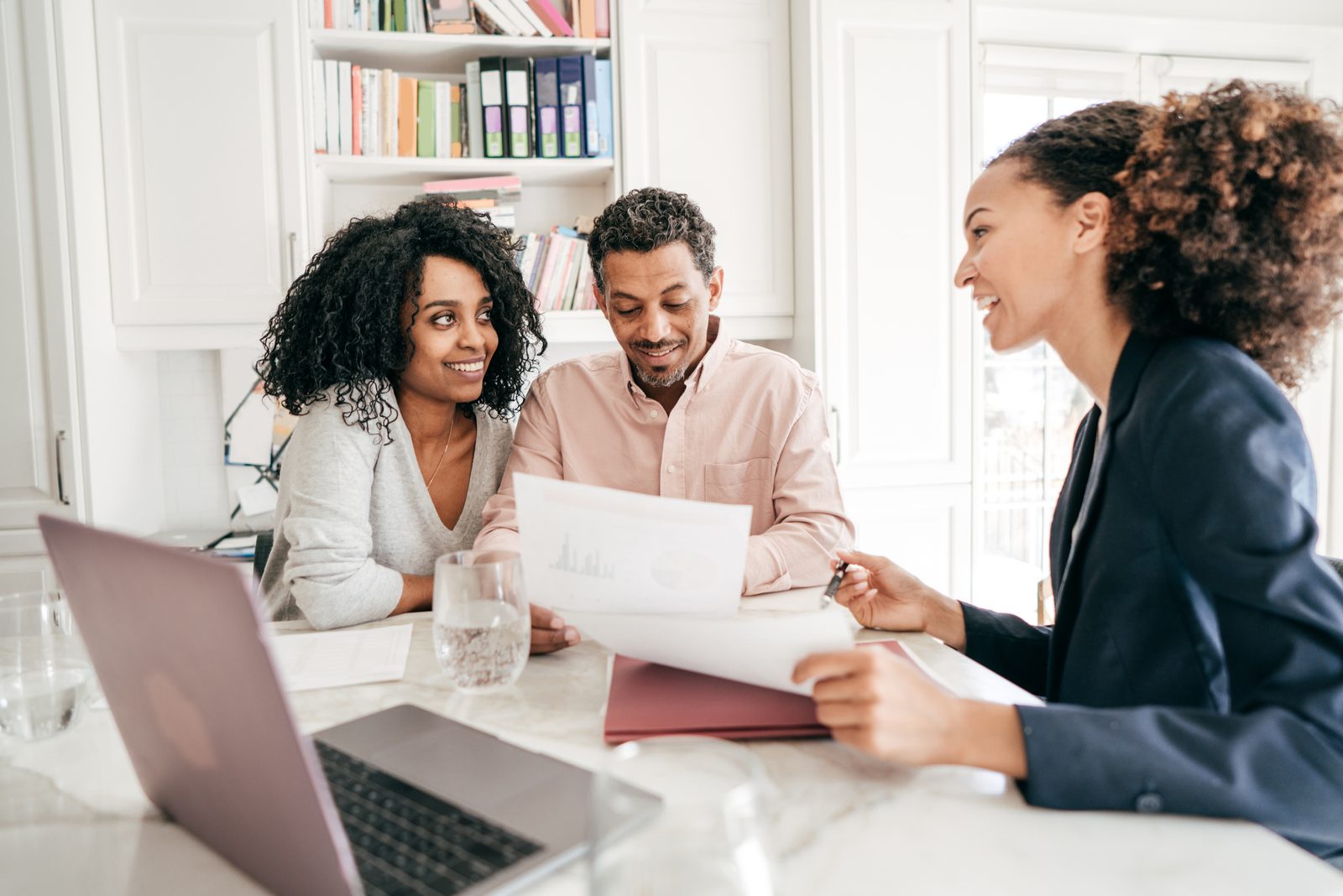 A Ward Communities specialist reviewing options with a couple — Build On Your Land