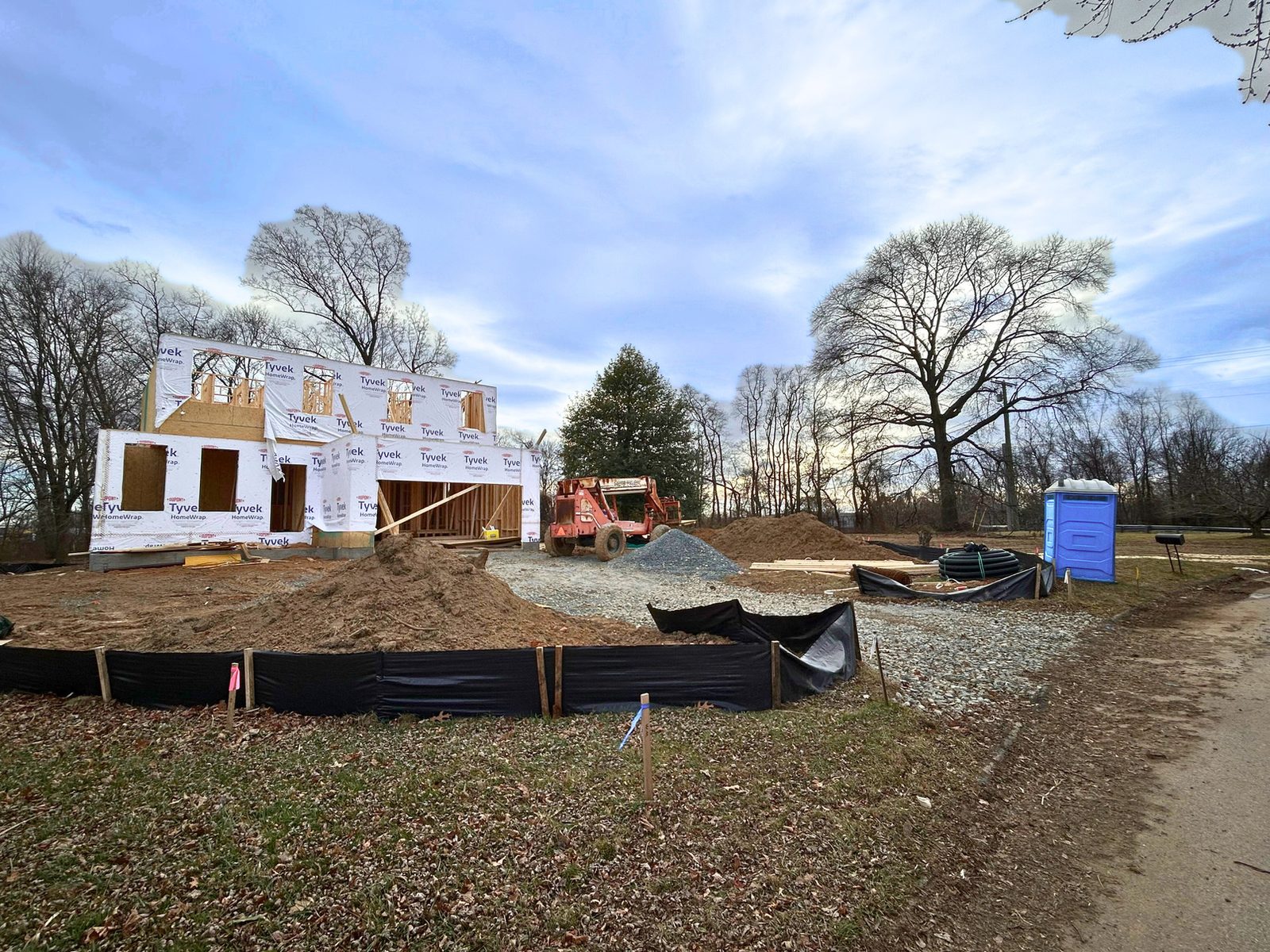 A Ward Communities home framed and rising on the homeowner's own land