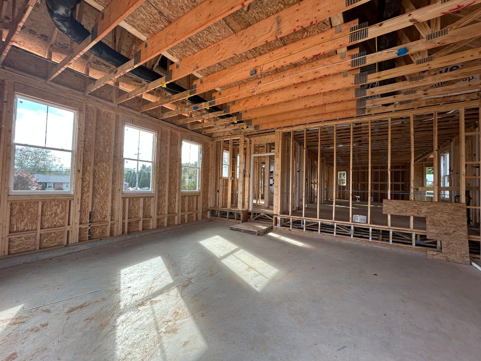 The framed interior of a Ward Communities home before drywall